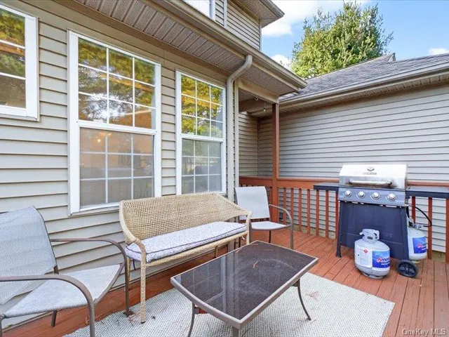 a view of a patio with wooden floor