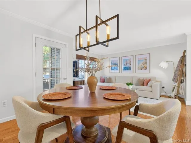 a view of a dining room with furniture and window