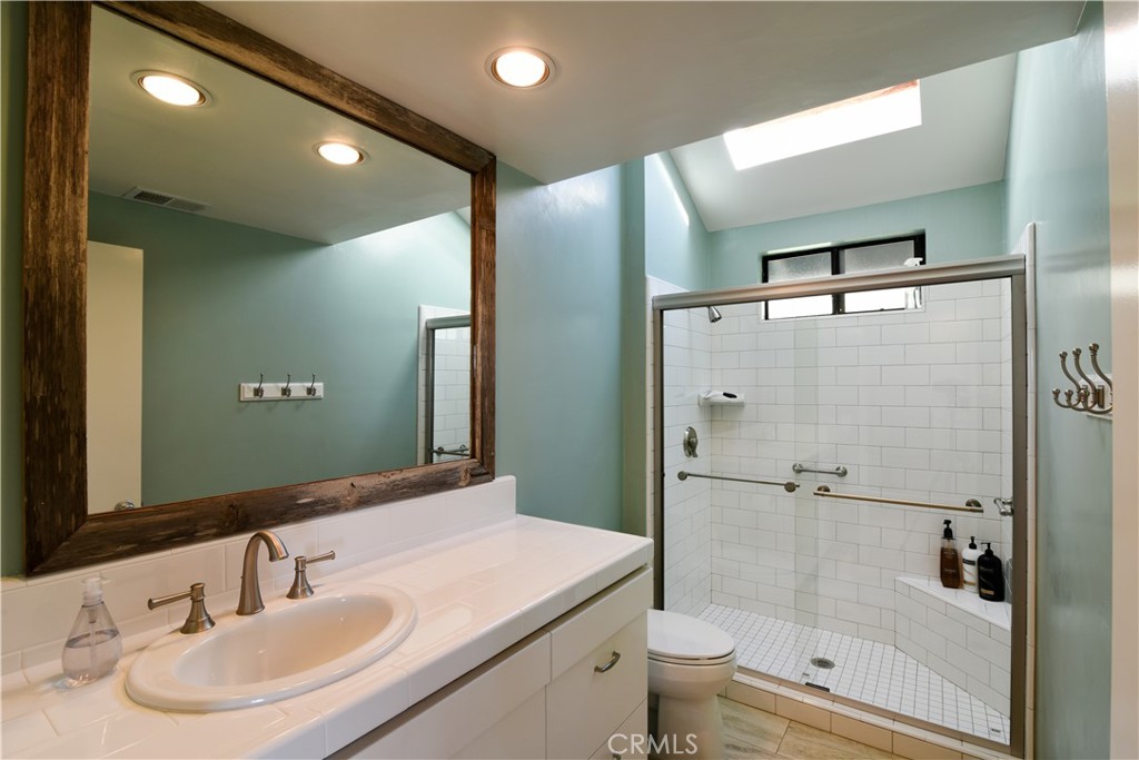 2640 Maple Morro Bay, CA 93442 - Photo 19 of 29 a bathroom with a sink toilet and shower