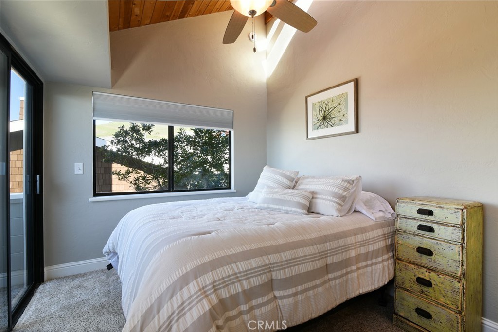 2640 Maple Morro Bay, CA 93442 - Photo 21 of 29 a bedroom with a bed and a window
