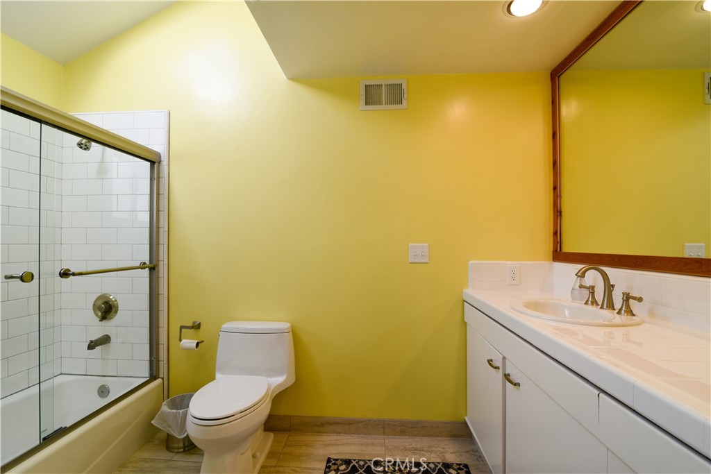 2640 Maple Morro Bay, CA 93442 - Photo 24 of 29 a bathroom with a sink mirror toilet and shower