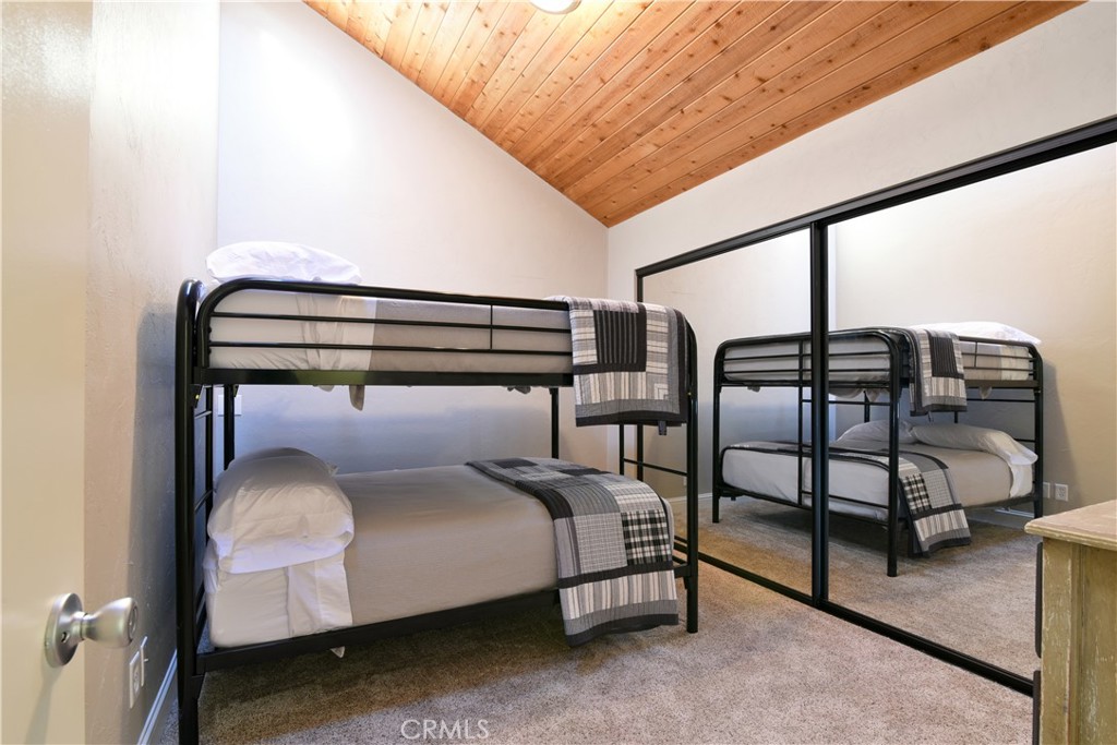 2640 Maple Morro Bay, CA 93442 - Photo 25 of 29 a bedroom with a bed and lamp