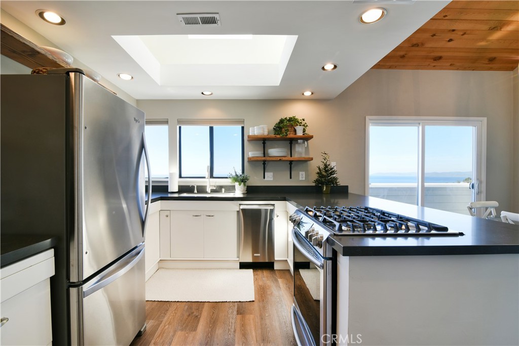 2640 Maple Morro Bay, CA 93442 - Photo 7 of 29 a kitchen with sink refrigerator and stove