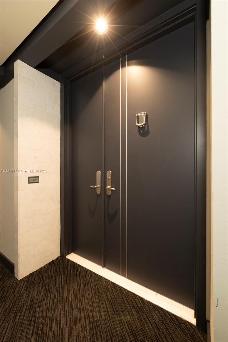 901 Brickell Key Boulevard, Unit 1409 Miami, FL 33131 - Photo 26 of 39 a bathroom with a shower