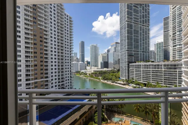 a view of a balcony with two chairs and a table