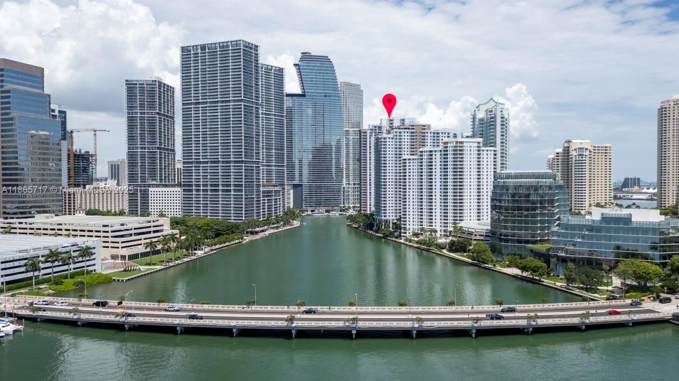 901 Brickell Key Boulevard, Unit 1409 Miami, FL 33131 - Photo 3 of 39 a view of building and lake