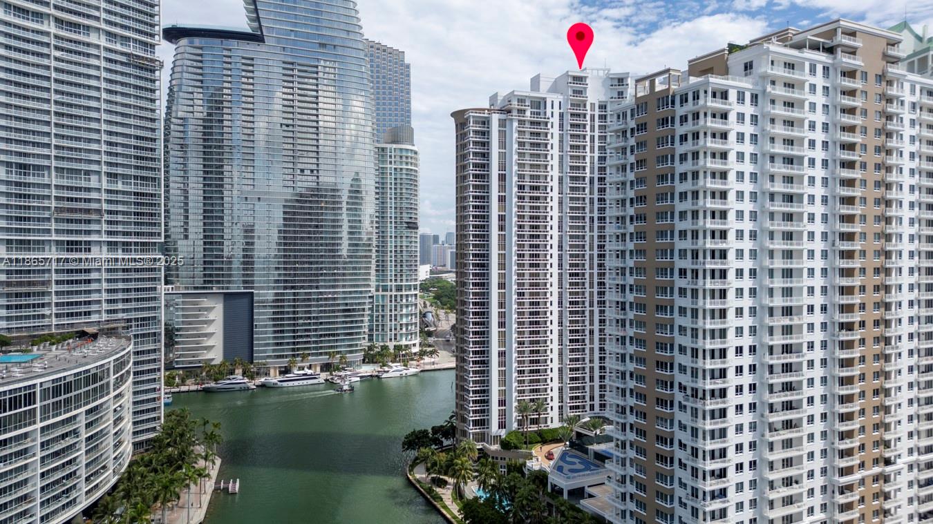 901 Brickell Key Boulevard, Unit 1409 Miami, FL 33131 - Photo 32 of 39 a view of a balcony with a potted plants