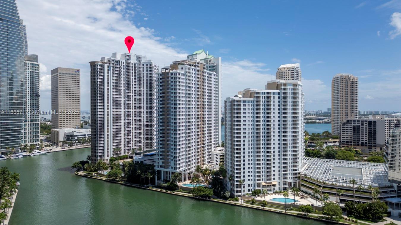 901 Brickell Key Boulevard, Unit 1409 Miami, FL 33131 - Photo 34 of 39 a view of city and a lake