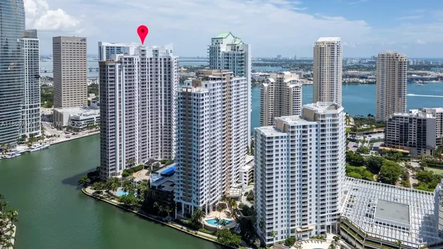 a view of roof deck with a chair and iron fence