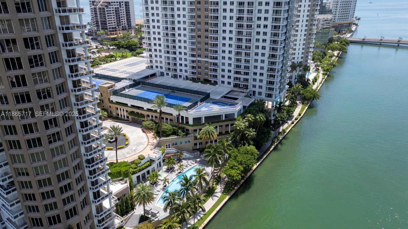 901 Brickell Key Boulevard, Unit 1409 Miami, FL 33131 - Photo 39 of 39 a view of a chairs and table in a patio