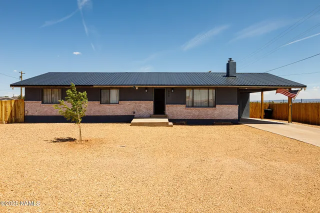 a balcony with table and chairs