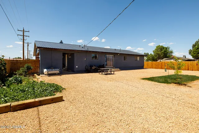 a view of a backyard of a house