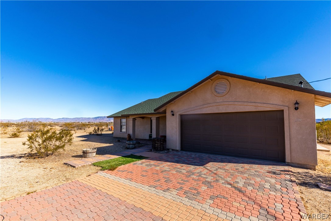 300 South Cibola Road Golden Valley, AZ 86413 - Photo 1 of 67 a front view of a house with a yard