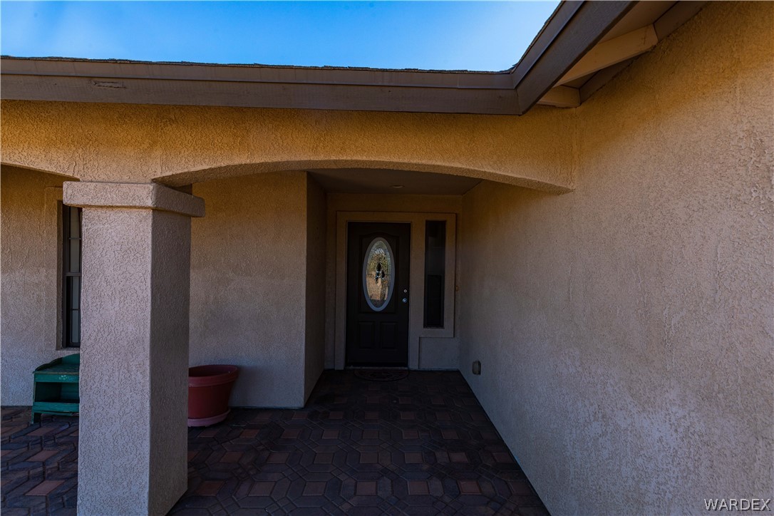300 South Cibola Road Golden Valley, AZ 86413 - Photo 54 of 67 a view of a hallway with wooden walls