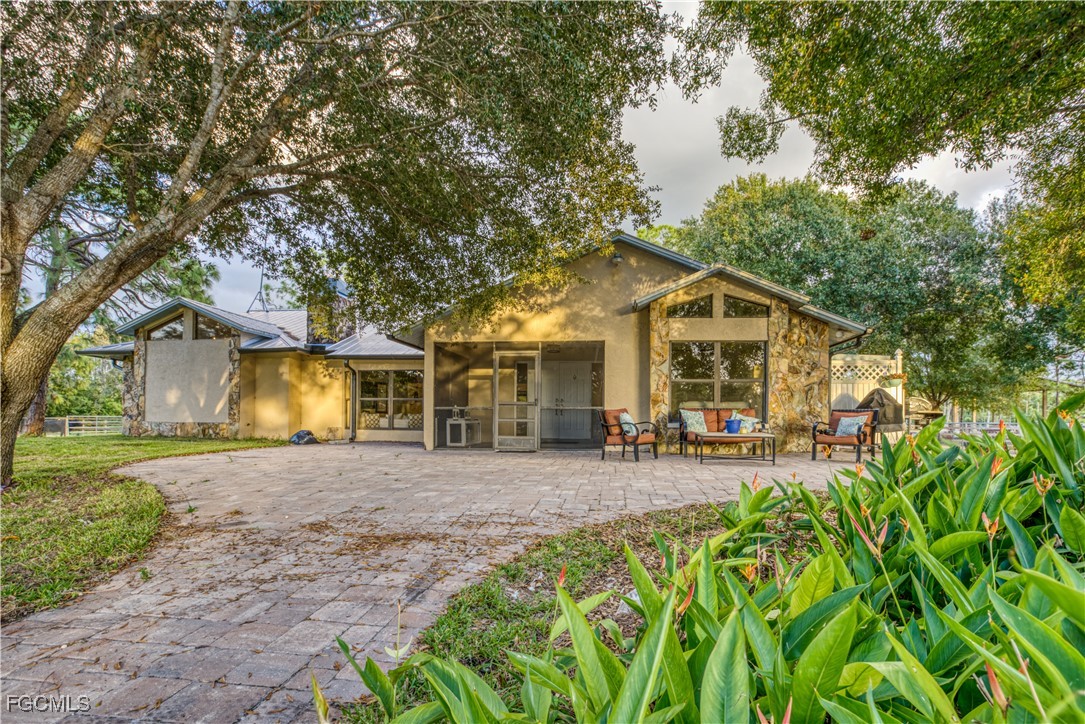 19740 Gottarde Road North Fort Myers, FL 33917 - Photo 1 of 12 a front view of a house with yard and green space