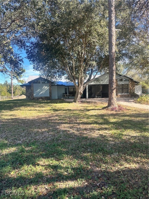 19740 Gottarde Road North Fort Myers, FL 33917 - Photo 3 of 12 a view of a swimming pool with an outdoor space and seating area