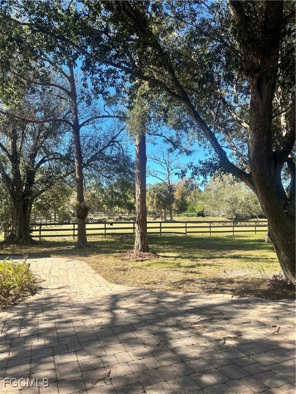 19740 Gottarde Road North Fort Myers, FL 33917 - Photo 5 of 12 a view of a yard with wooden fence