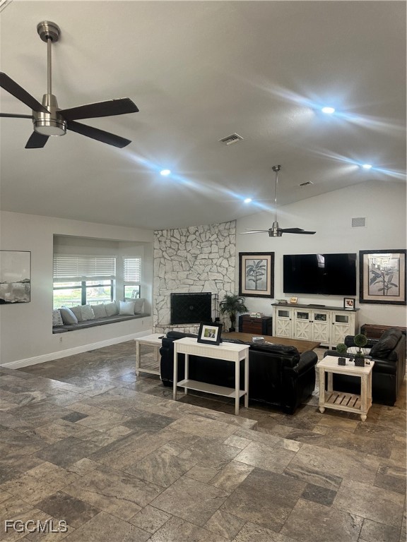19740 Gottarde Road North Fort Myers, FL 33917 - Photo 8 of 12 a living room with furniture a flat screen tv and kitchen view