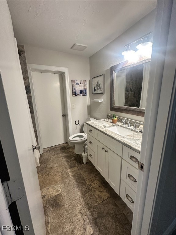 19740 Gottarde Road North Fort Myers, FL 33917 - Photo 10 of 12 a bathroom with a sink toilet and mirror