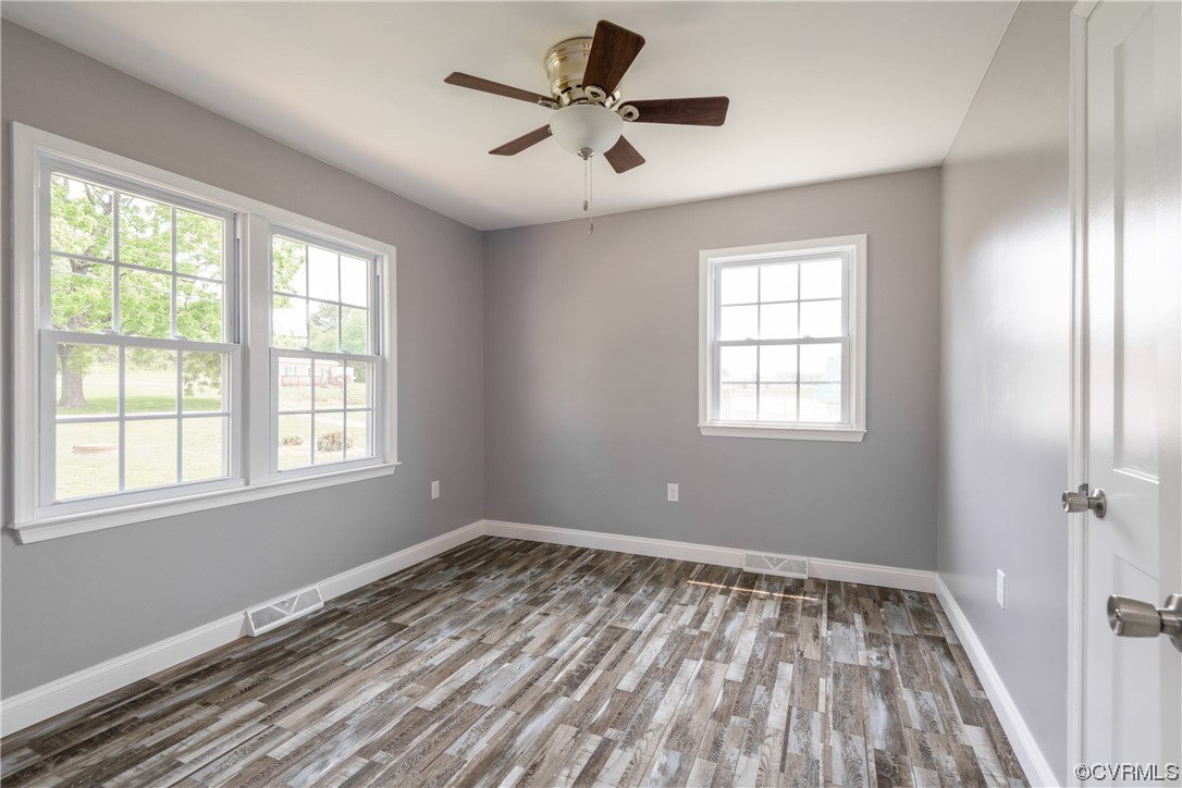 338 Prospect Road Prospect, VA 23960 - Photo 24 of 41 a view of empty room with wooden floor and fan