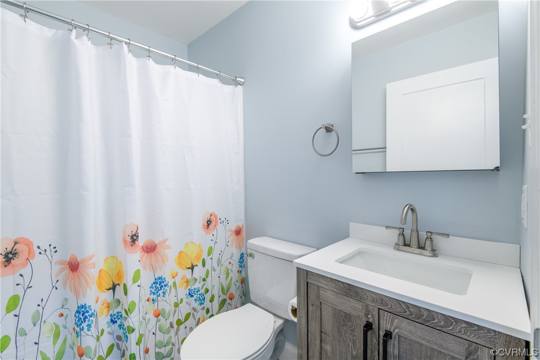 338 Prospect Road Prospect, VA 23960 - Photo 28 of 41 a bathroom with a sink a toilet and a mirror