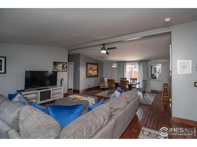 a kitchen with kitchen island granite countertop a stove a sink and a microwave