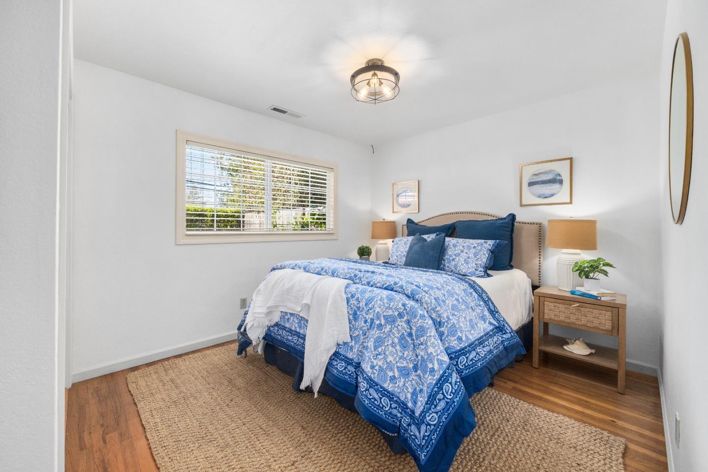 105 Wesley Street Capitola, CA 95010 - Photo 29 of 55 a spacious bedroom with a bed and a window