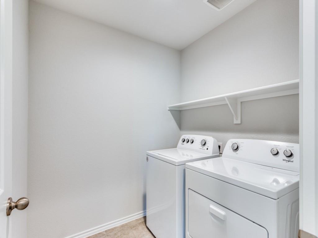 548 Bronze Circle West Springtown, TX 76082 - Photo 10 of 11 Laundry area featuring neutral wall tones, a built-in storage shelf, and tile flooring