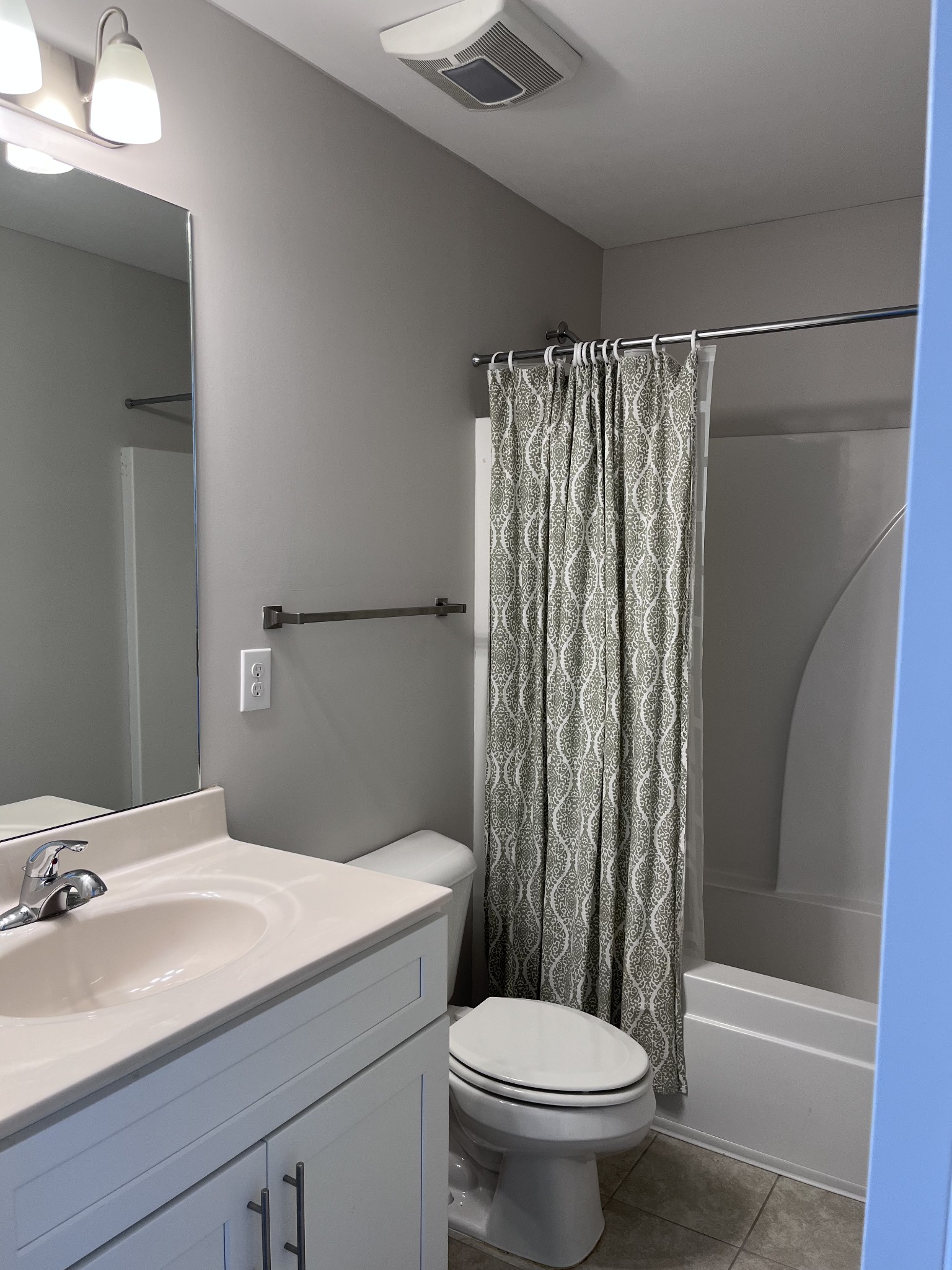 8011 Tuberose Court Spring Hill, TN 37174 - Photo 11 of 20 a bathroom with a sink a toilet and shower