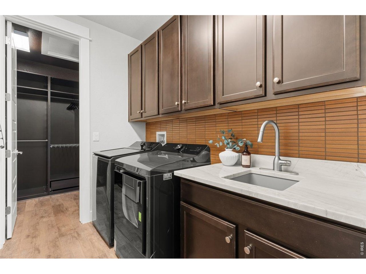 7027 Ruidoso Drive Windsor, CO 80550 - Photo 31 of 50 Laundry Room With Access from Primary Closet