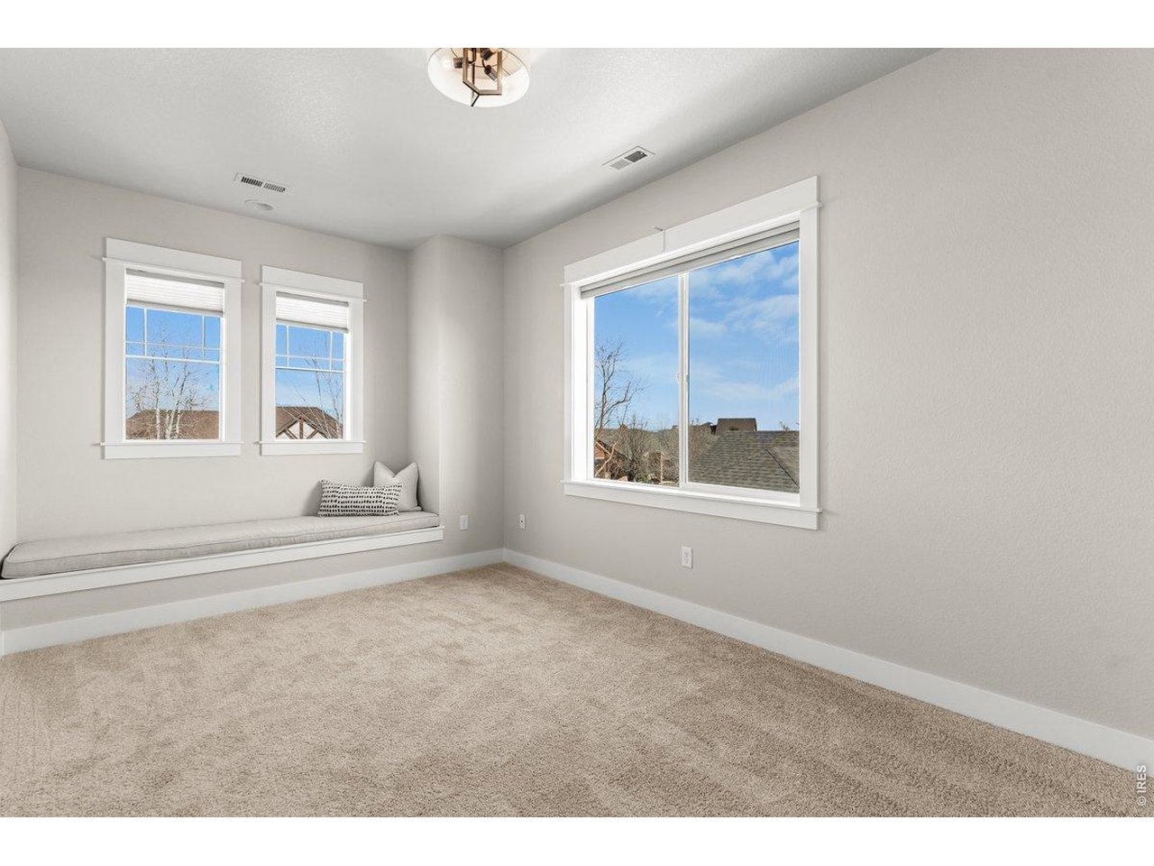 7027 Ruidoso Drive Windsor, CO 80550 - Photo 35 of 50 Another Large Bedroom with Window Seat