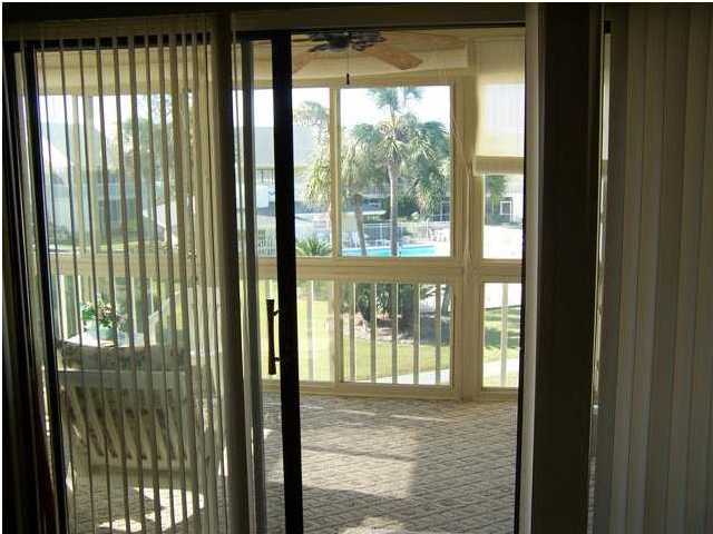 71 Misty Cove, Unit 207 Destin, FL 32550 - Photo 8 of 9 a view of a glass door and outside space