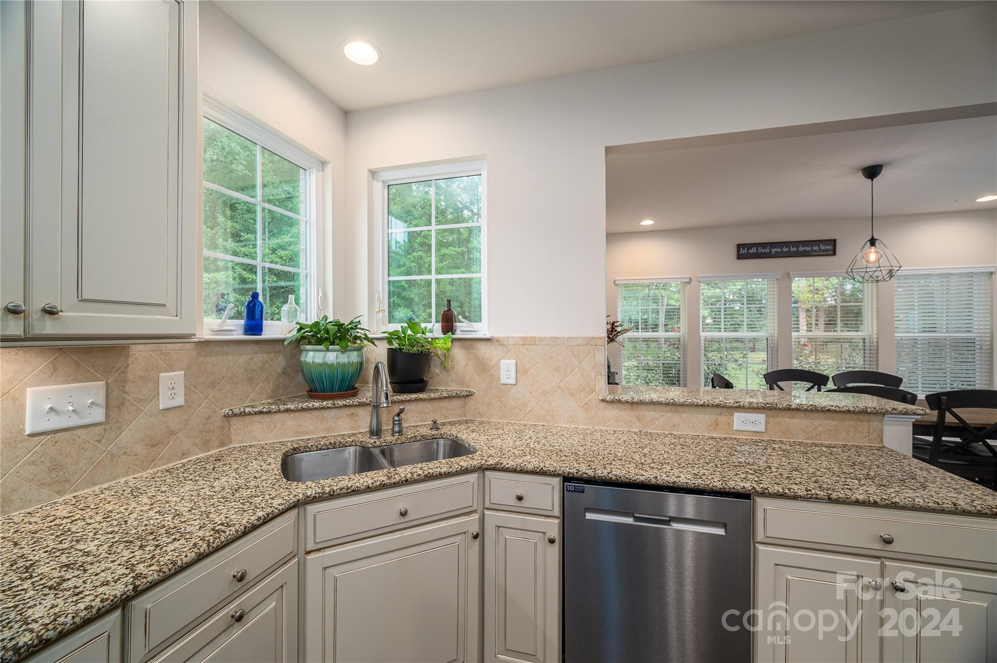 4050 Halyard Drive Denver, NC 28037 - Photo 14 of 48 a kitchen with granite countertop a sink and a window
