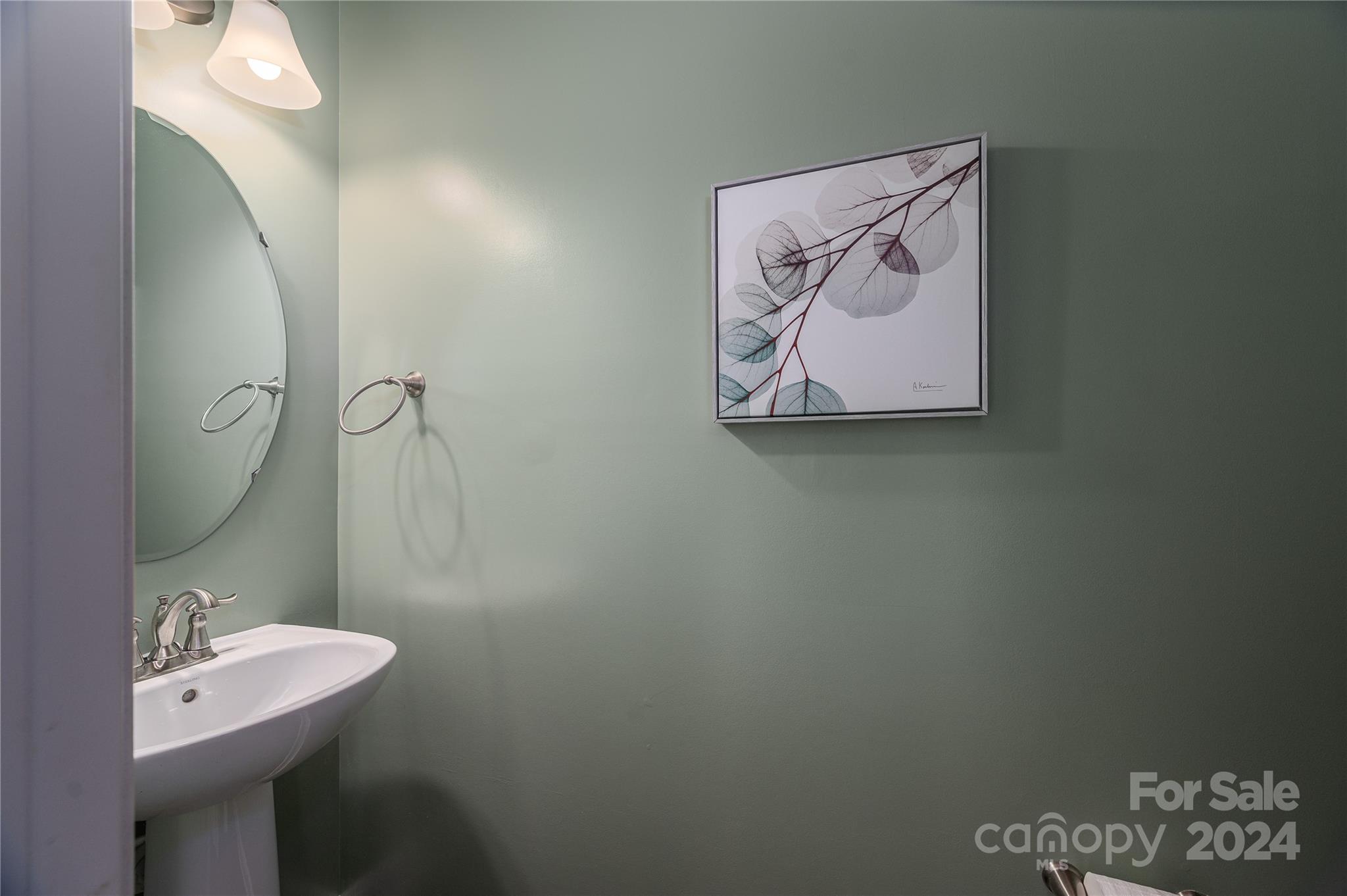 4050 Halyard Drive Denver, NC 28037 - Photo 21 of 48 a bathroom with a sink and mirror