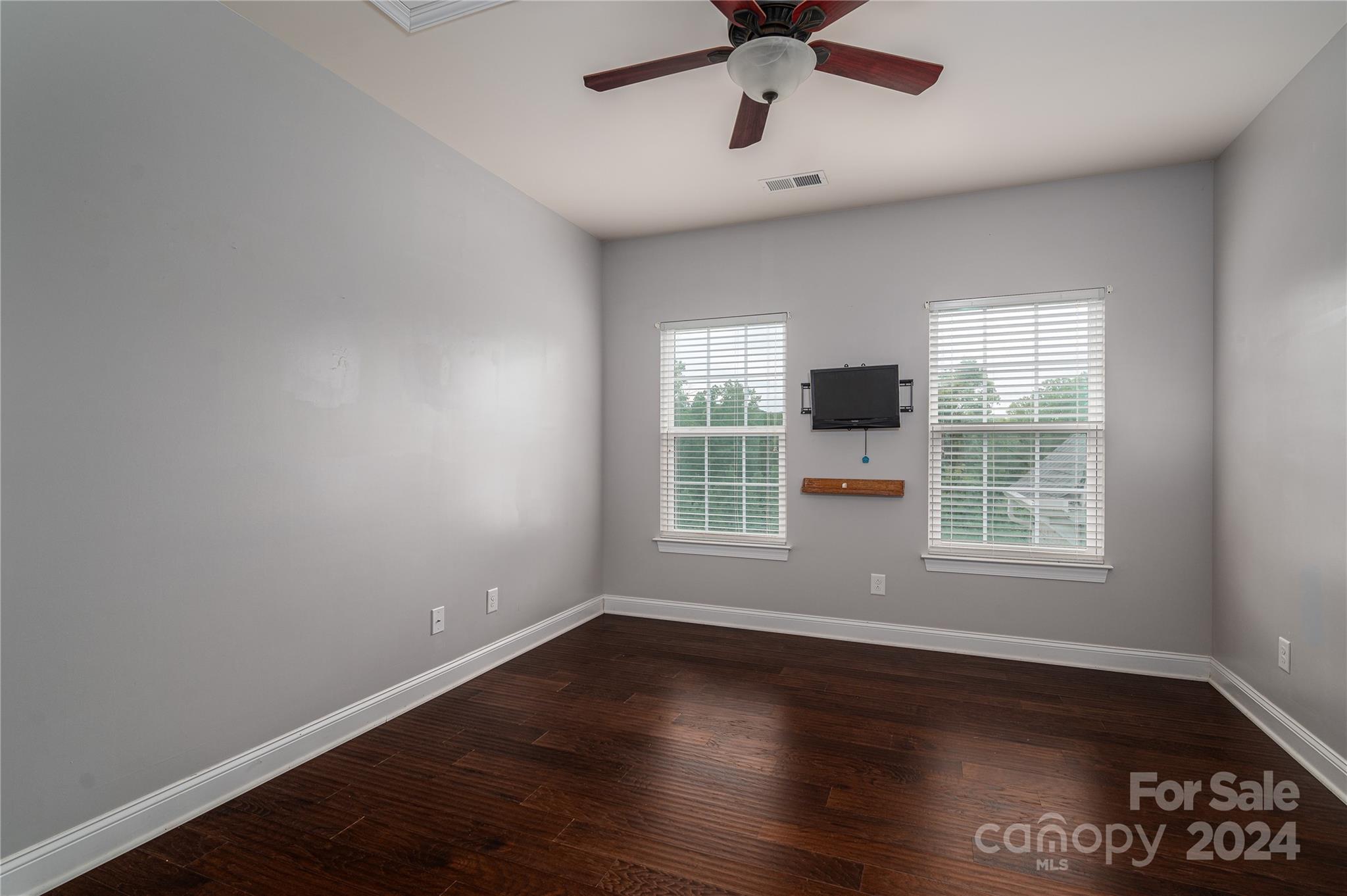 4050 Halyard Drive Denver, NC 28037 - Photo 31 of 48 an empty room with wooden floor and windows