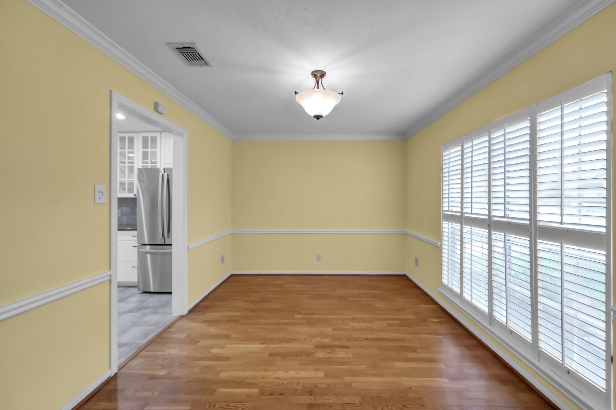 16135 Ridge Park Drive Houston, TX 77095 - Photo 10 of 27 Spacious dining area with upgraded chair molding and a wall of windows. Easy access right into the kitchen!