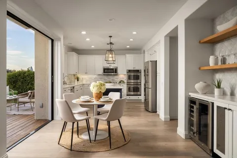 a living room with furniture or couch and a large window