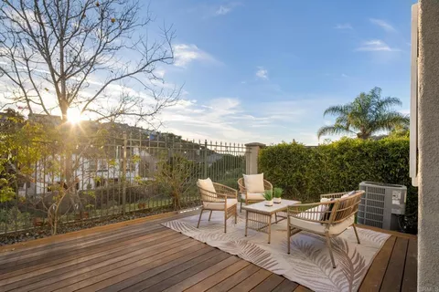 an aerial view of a houses with a lake