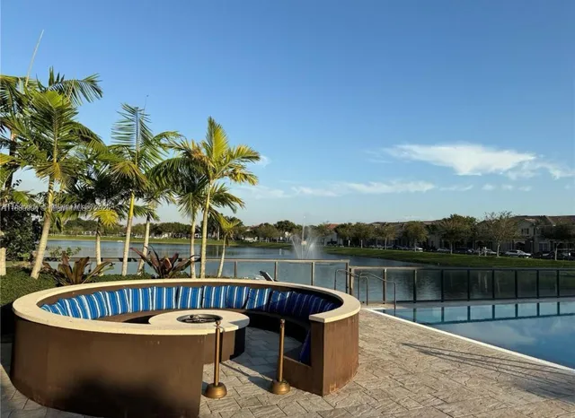 a view of a swimming pool with a lounge chair