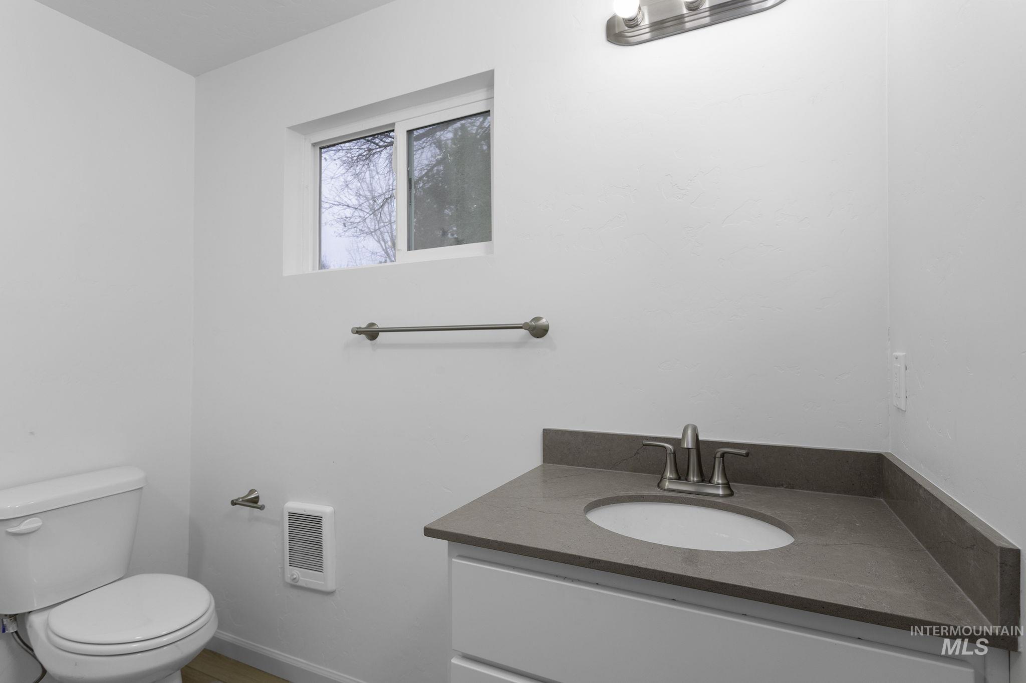 450 Greenleaf Street Boise, ID 83713 - Photo 14 of 17 Bathroom featuring vanity and heating unit