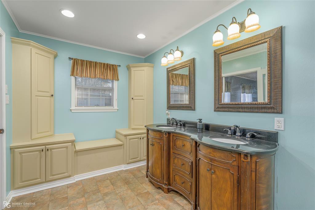803 Drew Lane Minden, LA 71055 - Photo 17 of 33 a bathroom with a granite countertop double vanity sink a mirror and a bathtub