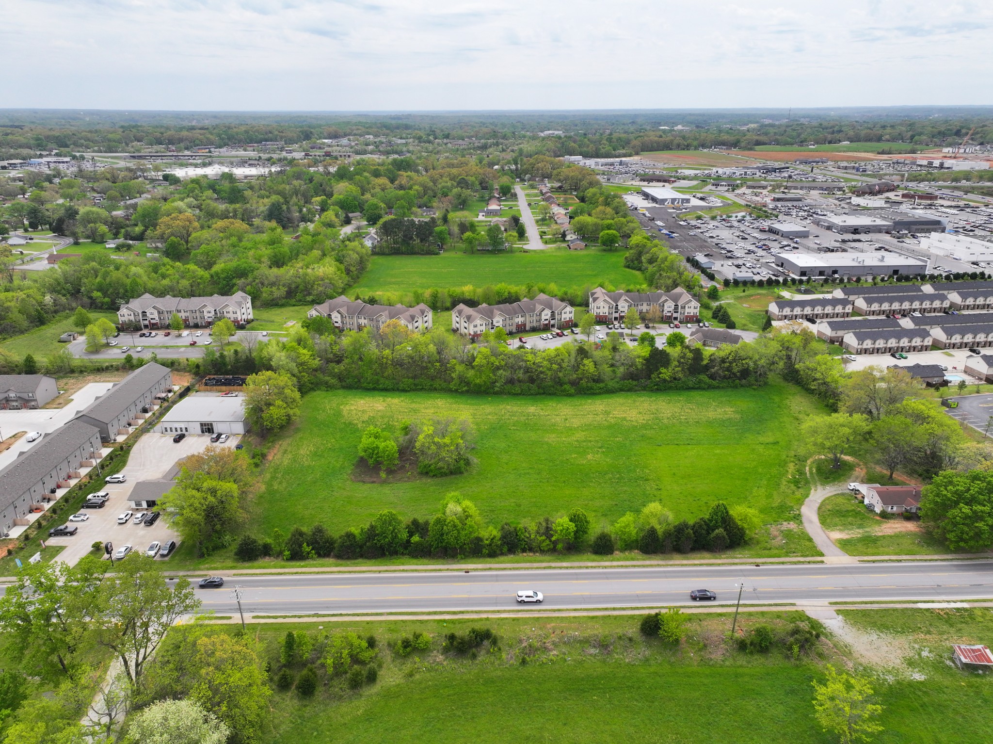 0 Needmore Road Clarksville, TN 37040 - Photo 3 of 20 an aerial view of a city with lots of residential buildings ocean and mountain view in back