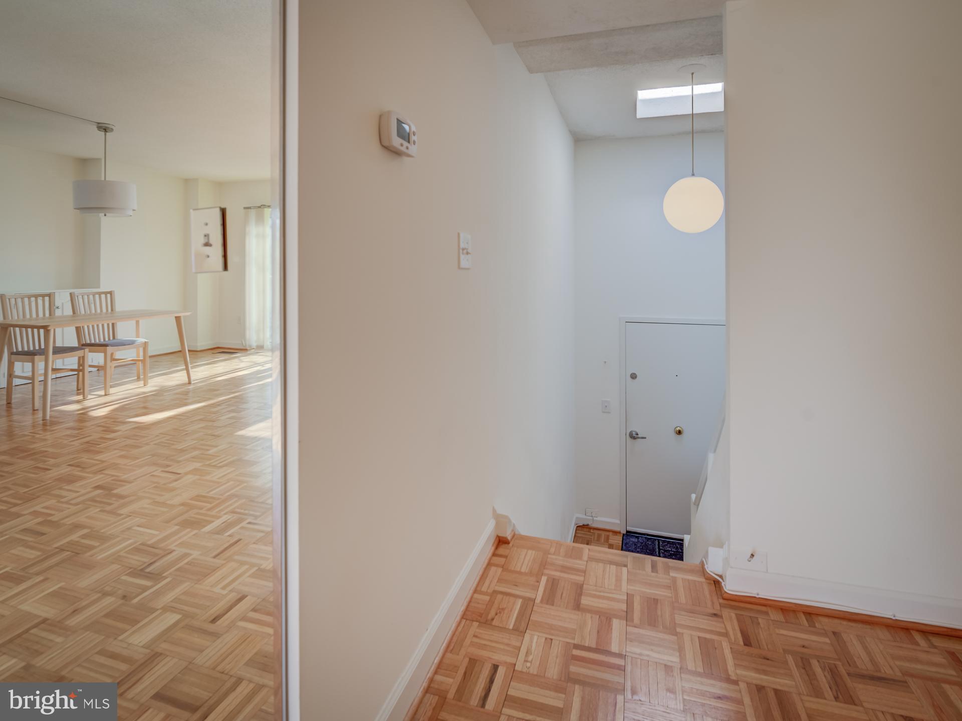 3210 Grace Street Northwest, Unit 309 Washington, DC 20007 - Photo 18 of 43 a view of a room with wooden floor and bathroom