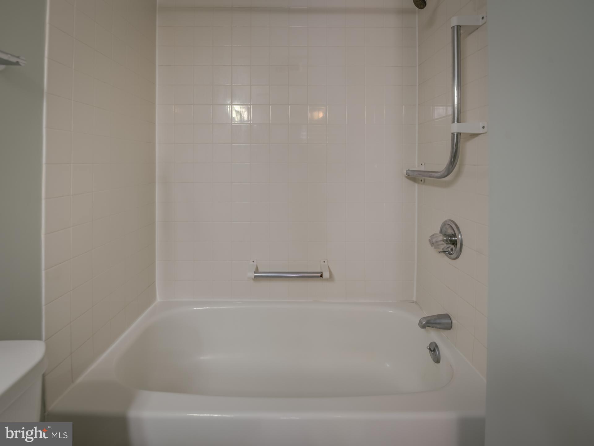 3210 Grace Street Northwest, Unit 309 Washington, DC 20007 - Photo 28 of 43 a close view of a bathtub in bathroom