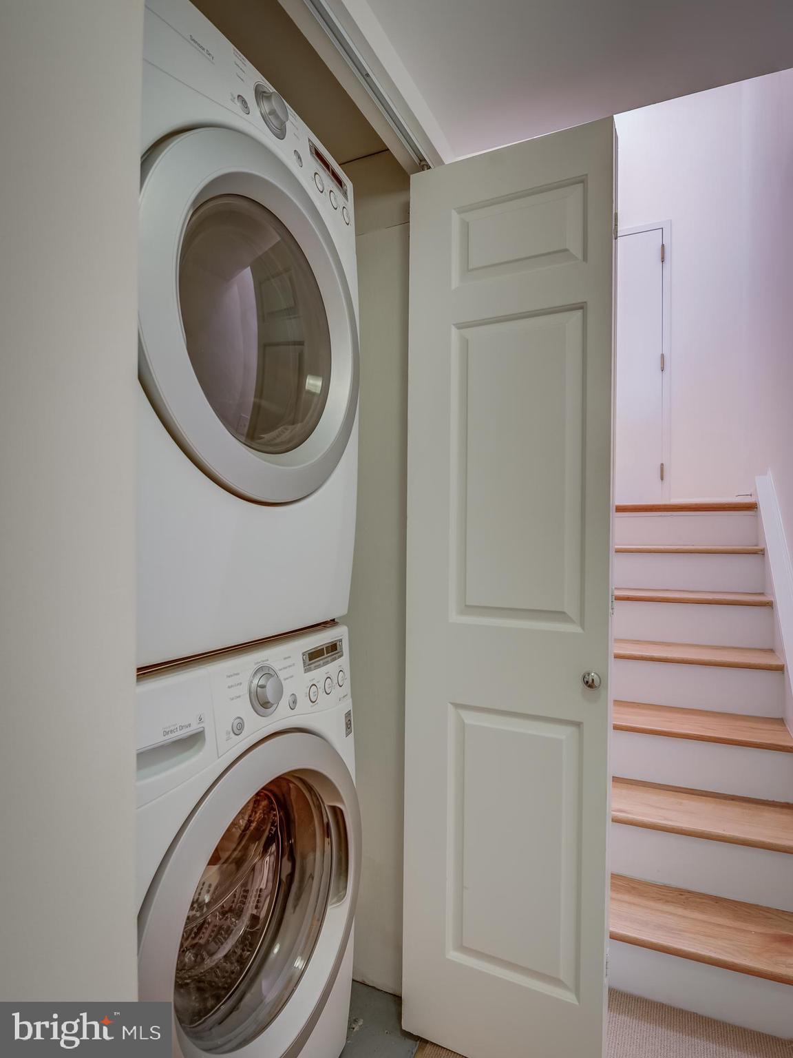 3210 Grace Street Northwest, Unit 309 Washington, DC 20007 - Photo 30 of 43 a view of a hallway with washer and dryer