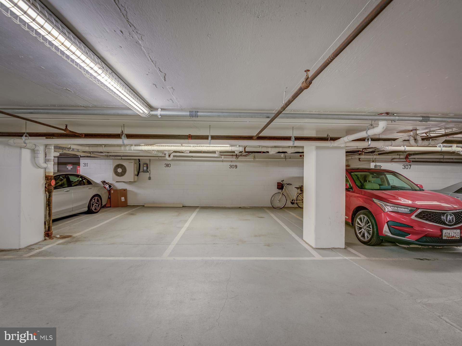 3210 Grace Street Northwest, Unit 309 Washington, DC 20007 - Photo 32 of 43 a view of parking garage with cars parked