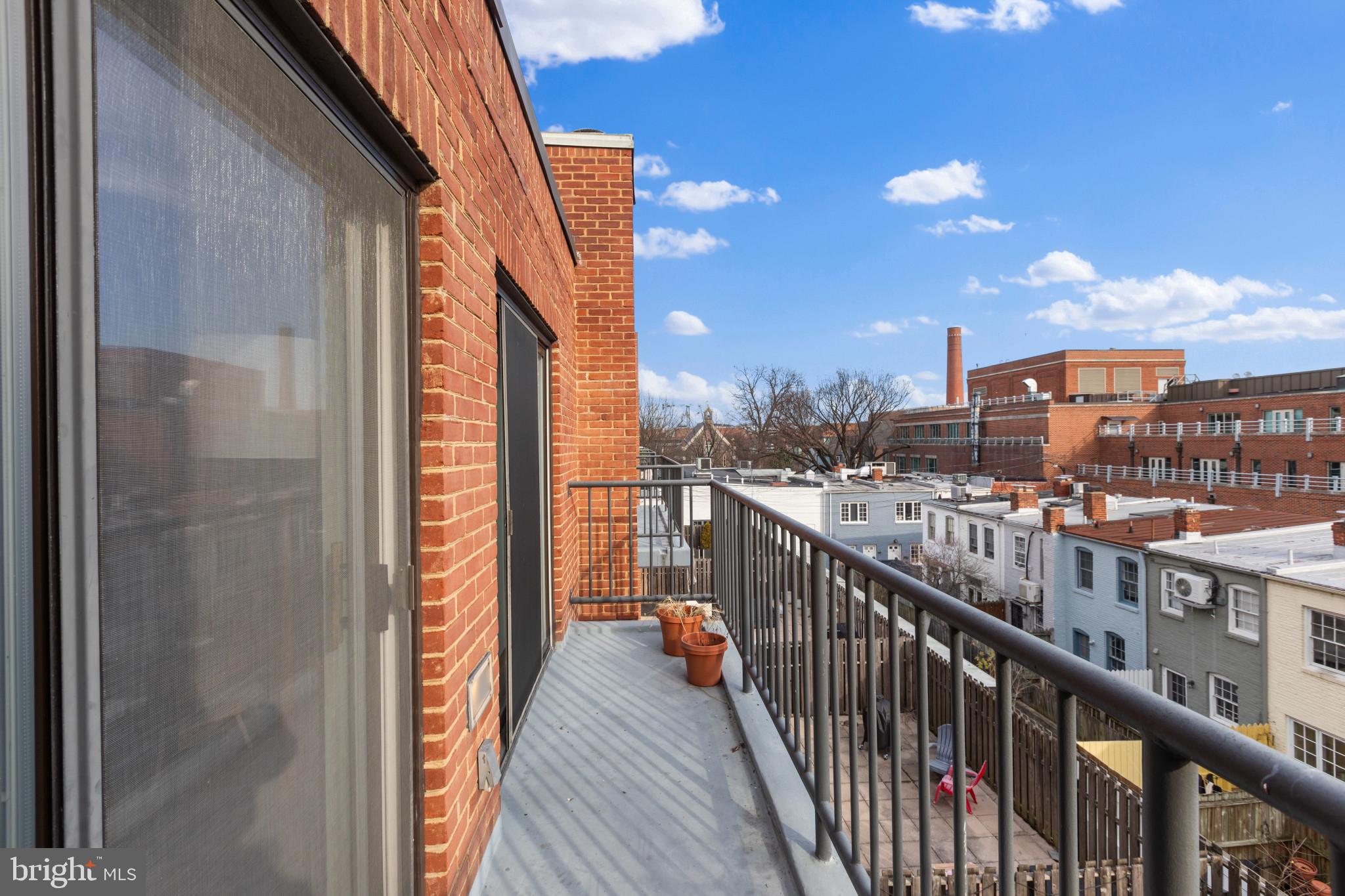 3210 Grace Street Northwest, Unit 309 Washington, DC 20007 - Photo 9 of 43 a balcony with city view