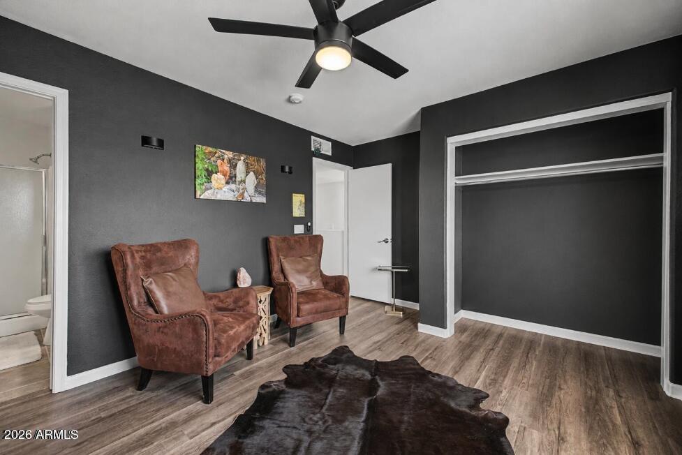 860 North McQueen Road, Unit 1135 Chandler, AZ 85225 - Photo 15 of 24 a bedroom with furniture and a ceiling fan