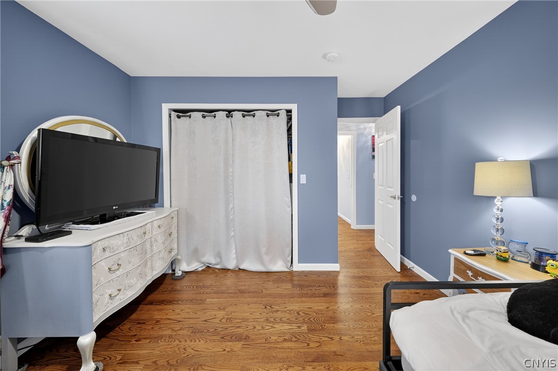 8245 Kirkville Road Manlius, NY 13082 - Photo 30 of 50 Spacious closet, ceiling fan and pristine hardwood