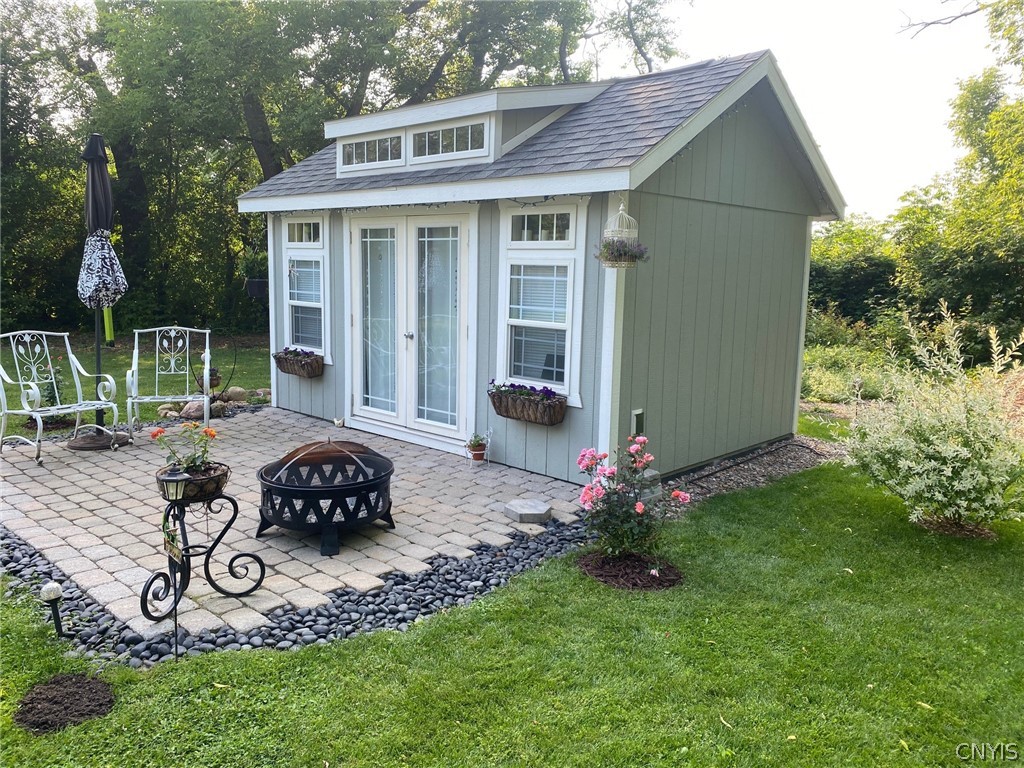 8245 Kirkville Road Manlius, NY 13082 - Photo 43 of 50 Side view. Beautiful paver and rock compliment the